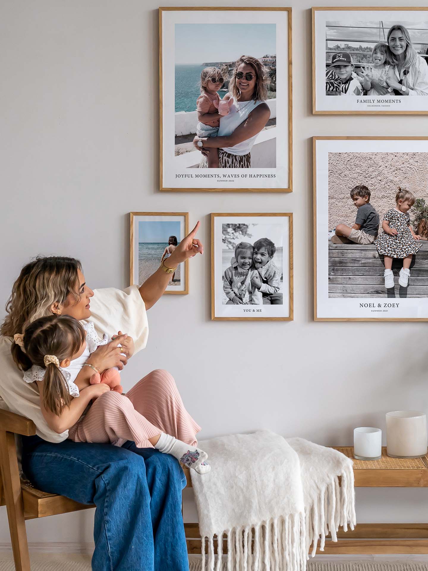 Mother showing her daughter a gallery wall