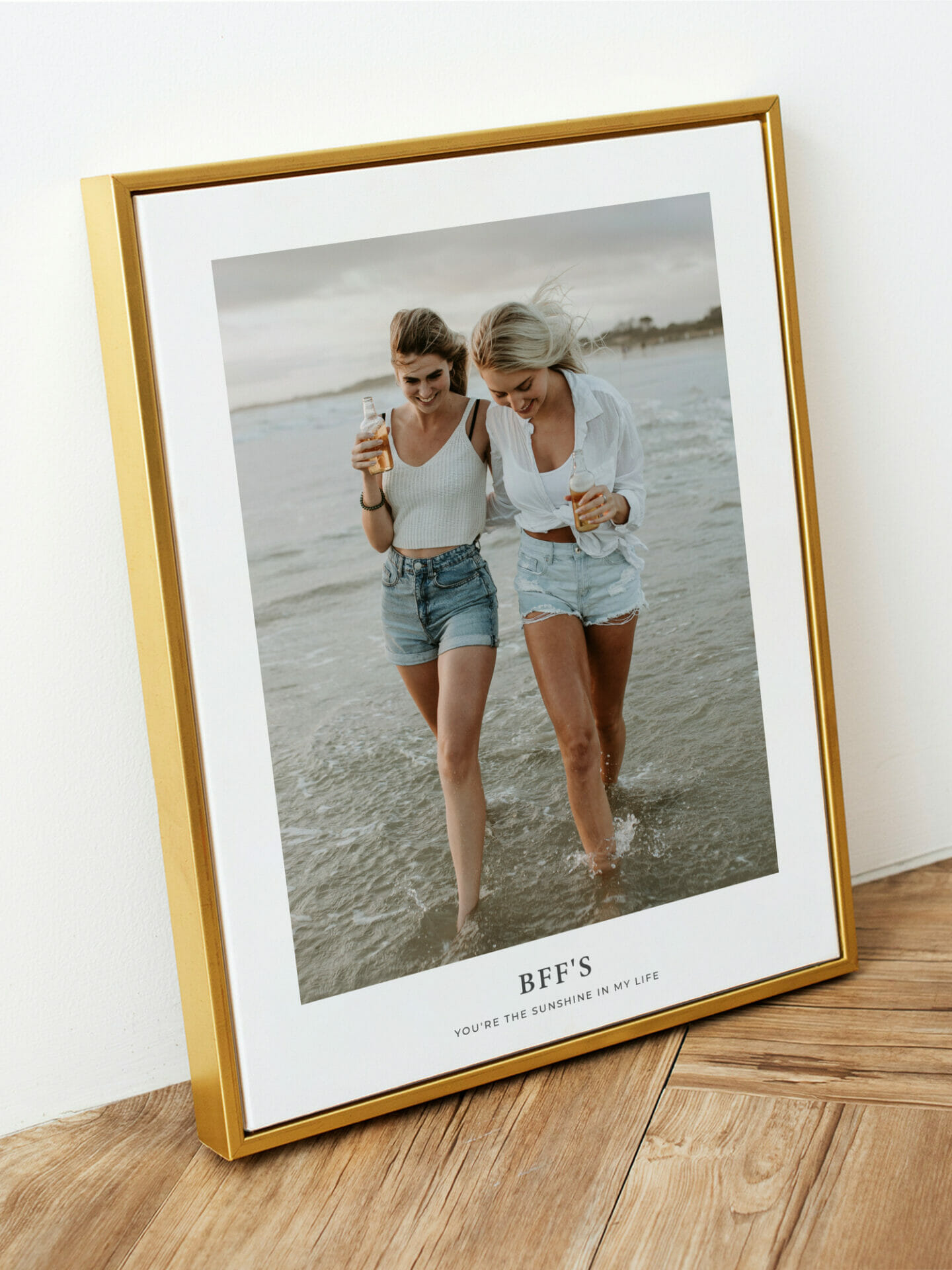 Interior with frames posters showing two best friends walking on the beach together