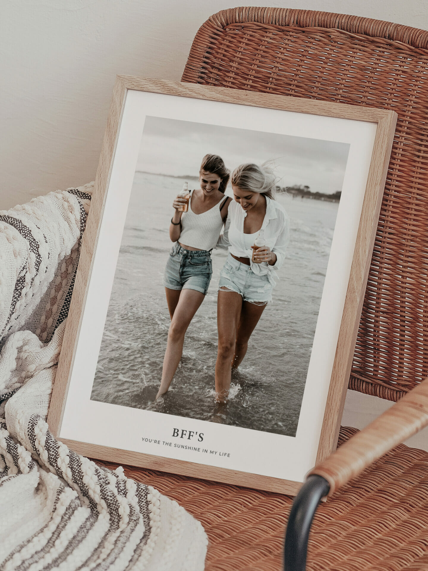 Interior with frames posters showing two best friends walking on the beach together