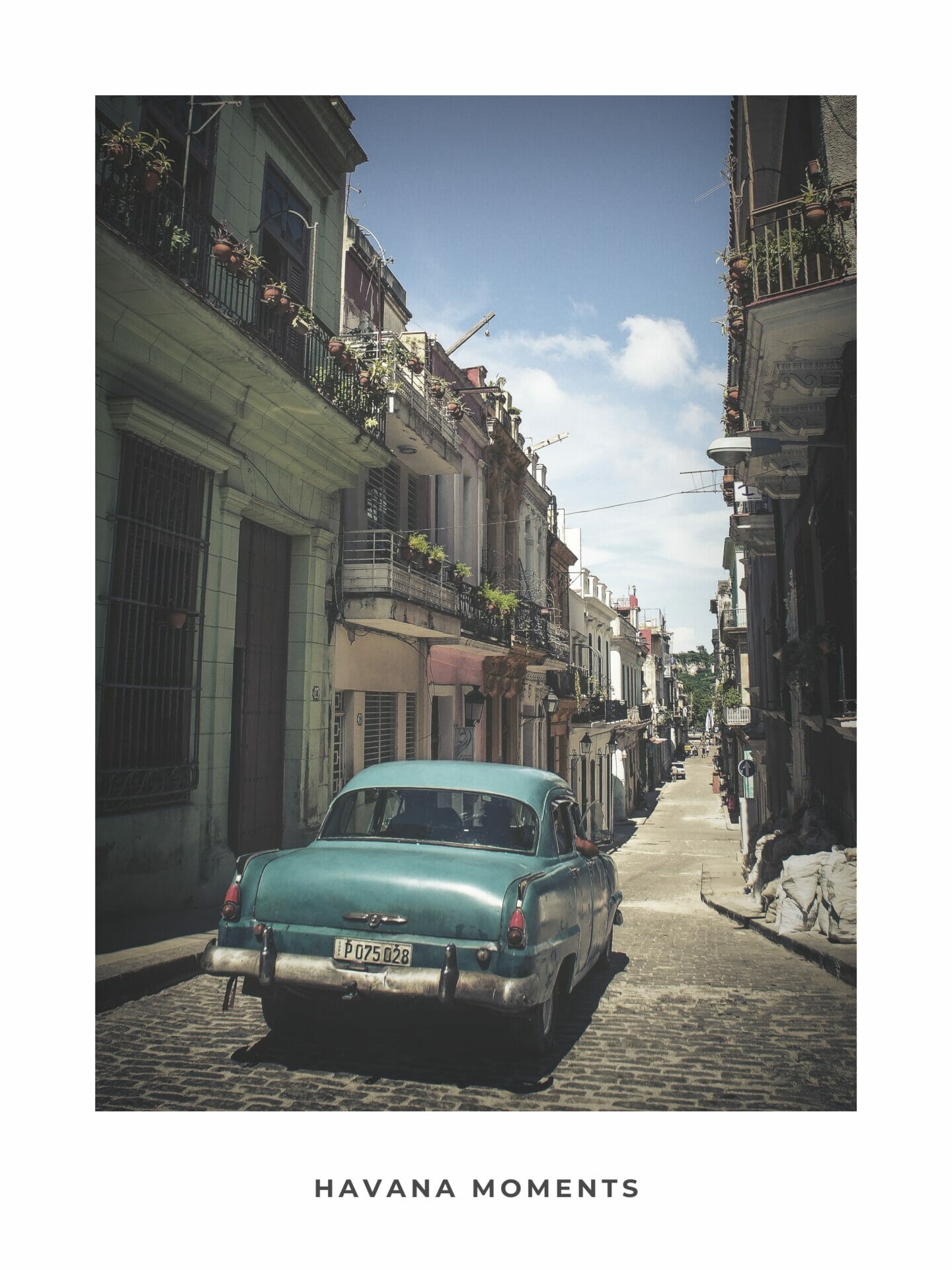 Poster of vintage car driving in old parts of Havana