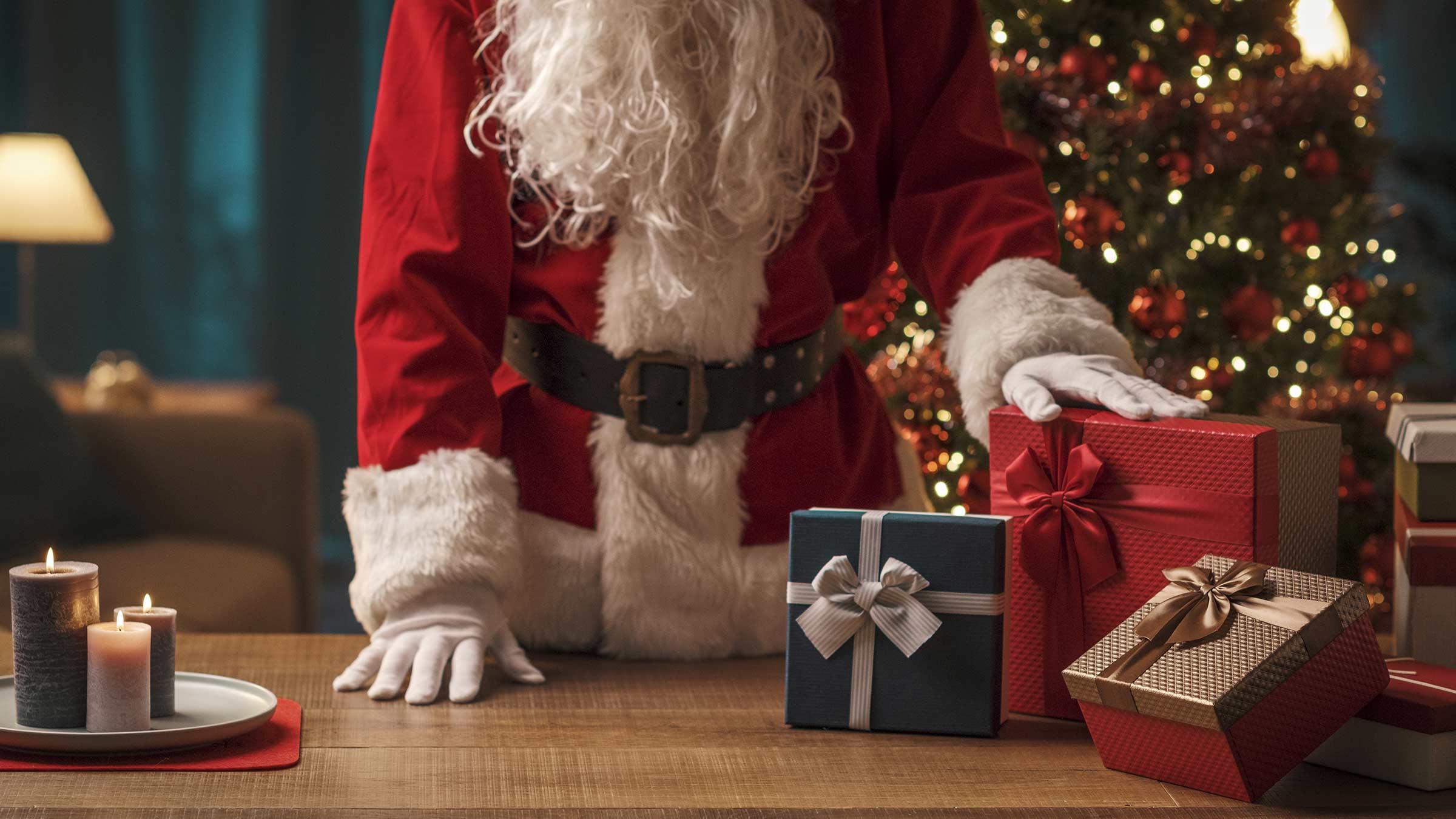 Santa Claus preparing Christmas gifts